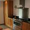 Contemporary finish oak kitchen with free standing island unit (view1)